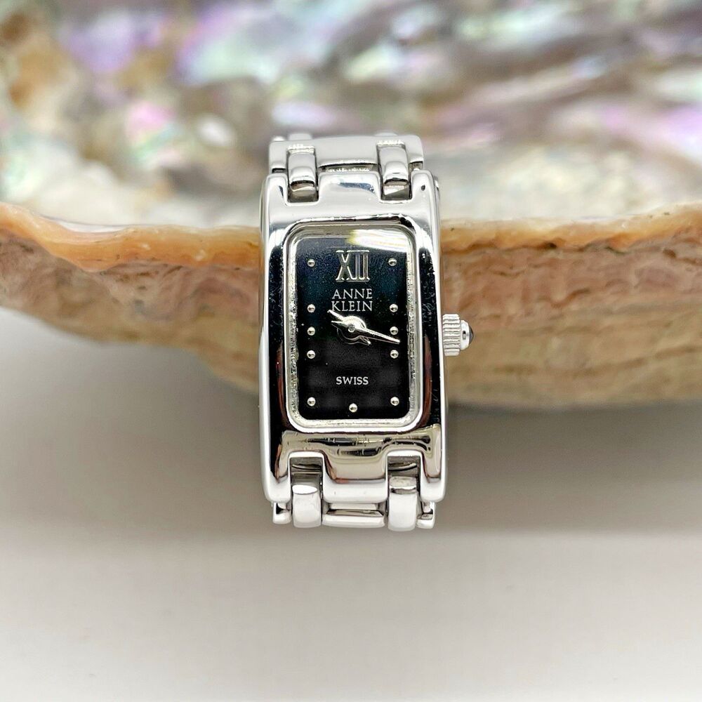 Anne Klein Women's Adjustable Silver Bracelet Watch Black Face 12/6618-19-21